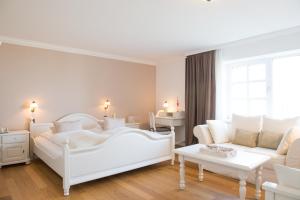 Katil atau katil-katil dalam bilik di Lodge am Meer