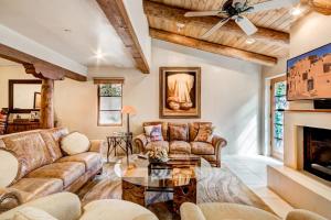 a living room with couches and a fireplace at El Corazon de Santa Fe, 3 Bedrooms, Sleeps 6, Flat Panel TVs, Fireplaces in Santa Fe