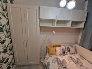Łóżko lub łóżka w pokoju w obiekcie City Center Studio Apartments
