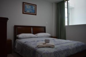 Postel nebo postele na pokoji v ubytování Dorado Plaza