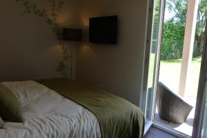 Postel nebo postele na pokoji v ubytování B&B Riche Terre