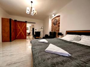 Кровать или кровати в номере Apartament Grodzki