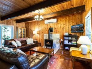 TV a/nebo společenská místnost v ubytování Forest View Chalet