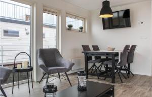 a living room with a dining room table and chairs at Bluff in Aalsmeer