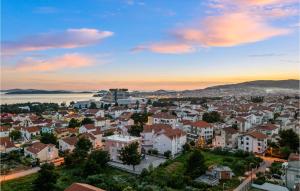 a cityscape of a town at sunset at 3 Bedroom Amazing Apartment In Vodice in Vodice +28 photos