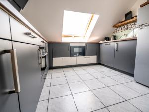 Kuchyň nebo kuchyňský kout v ubytování Penthouse-Suite near University