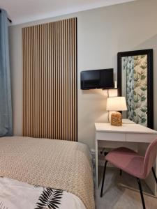 Łóżko lub łóżka w pokoju w obiekcie City Center Studio Apartments