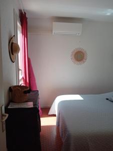 a hotel room with a bed and a window at Les Boramars 4 23 climatisé wifi 300m plage in Argelès-sur-Mer