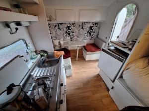 a small kitchen with a sink and a stove at Caravane on the beach in Lucciana