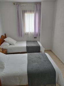 Una cama o camas en una habitación de CAL JAN - SOLANA