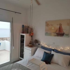 A bed or beds in a room at Seafront Aegean Νest