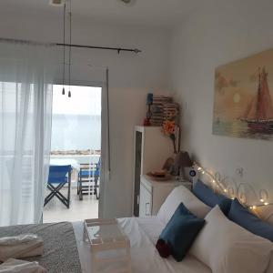 A bed or beds in a room at Seafront Aegean Νest Még 37 kép
