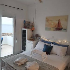 A bed or beds in a room at Seafront Aegean Νest