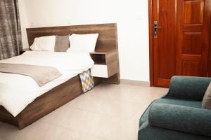 Ліжко або ліжка в номері KIGALI VILLa