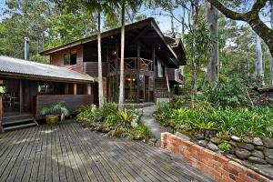 a house with a wooden deck in front of it at Salisbury Lodges in Salisbury