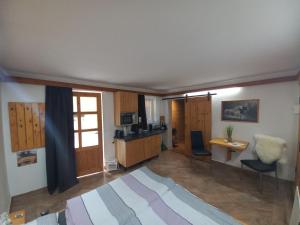 a living room with a table and a desk in it at Pferdehof Reitingau in Mautern in Steiermark