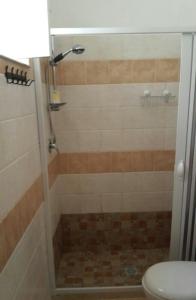 a bathroom with a shower with a toilet at Favignana KasAle in Favignana