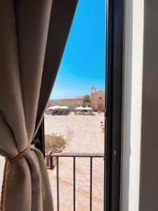 a view of a desert from a window at Regina Margherita B&B in Marzamemi