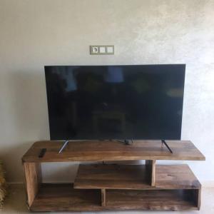 a flat screen tv sitting on a wooden table at Marrakesh Pearl Gardens Amazing 2 Bedrooms apartment in Marrakech