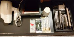 a desk with a nintendo wii controller and other items at HOTEL ROY(Adult Only) in Yokohama