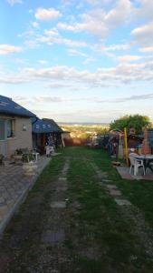 a view of a yard with tables and chairs at Casa Denis rustic in Turda