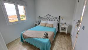 Ein Bett oder Betten in einem Zimmer der Unterkunft La Casita del Arco Ático