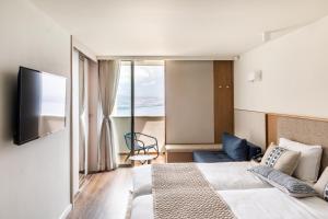 TV a/nebo společenská místnost v ubytování King Solomon Hotel Tiberias