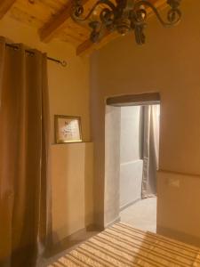 A bed or beds in a room at Corte Boero Bed&Breakfast