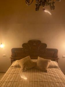 A bed or beds in a room at Corte Boero Bed&Breakfast