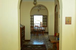 a hallway with an archway leading to a dining room at Villa Belzoni in Luxor