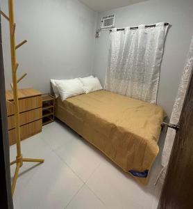 Postel nebo postele na pokoji v ubytování Isla Maison Homestay