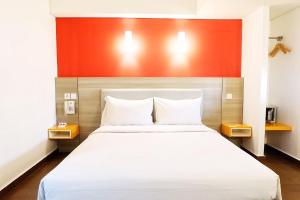 Postel nebo postele na pokoji v ubytování Amaris Hotel Thamrin City + 21 fotografií