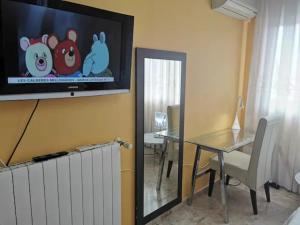 تلفاز و/أو أجهزة ترفيهية في alojamiento de lujo en playa arenal de Burriana