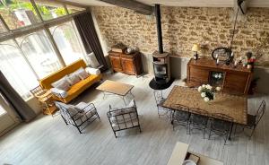 an aerial view of a living room with a fireplace at Mas de l'Estiou in Monteux