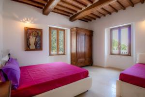 Postel nebo postele na pokoji v ubytování Villa Porticciolo