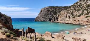 a beach with a group of people and the ocean at Casa vacanza in Fluminimaggiore +25 photos
