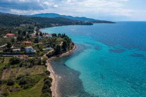 an aerial view of a beach and the ocean at Stone-Home Living in Neos Marmaras