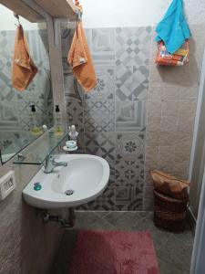 a bathroom with a white sink and a mirror at Magi - Violetta in Ponza