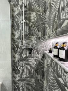 a bathroom with a black and white wallpaper at DM Rome Holiday in Rome
