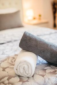 a sock sitting on top of a bed at Villa Corali Apartments Sea Breath & Pool in Amoudi