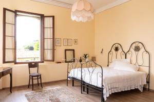 Postel nebo postele na pokoji v ubytování Fiori&vigne di Cecilia Marcon