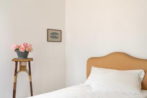 Postel nebo postele na pokoji v ubytování Fiori&vigne di Cecilia Marcon