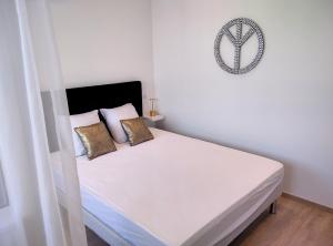 Łóżko lub łóżka w pokoju w obiekcie Résidence Graziella Appartement 621