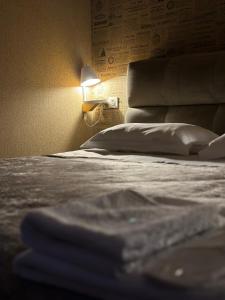 A bed or beds in a room at Old district