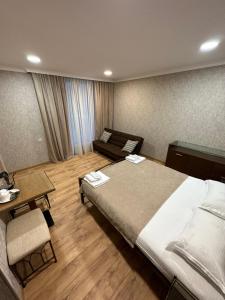 A bed or beds in a room at Old district