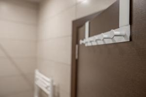 a brown door with a white door knob and a room at BAJKA in Kragujevac