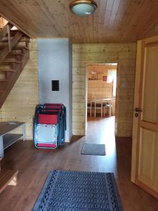 a room with a staircase and luggage in a cabin at Apartament nad Zalewem in Biszcza