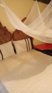 Katil atau katil-katil dalam bilik di Urban Oasis Retreat