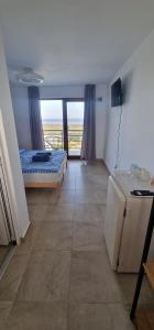Кровать или кровати в номере SunScape Corbu