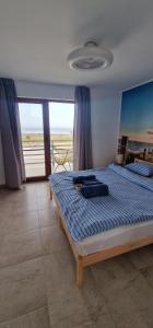 Кровать или кровати в номере SunScape Corbu